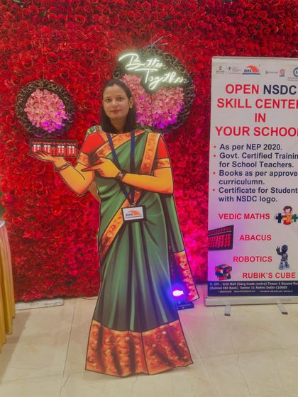 Posing with our interactive display at an education event. We actively engage with the teaching community to promote our NSDC-approved skill centers.