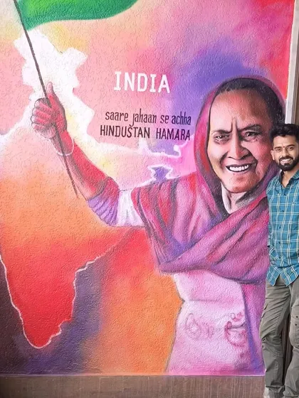 A photo of me standing next to the completed patriotic mural. The message "Sare Jahaan Se Achha Hindustan Hamara" is at the heart of this piece.