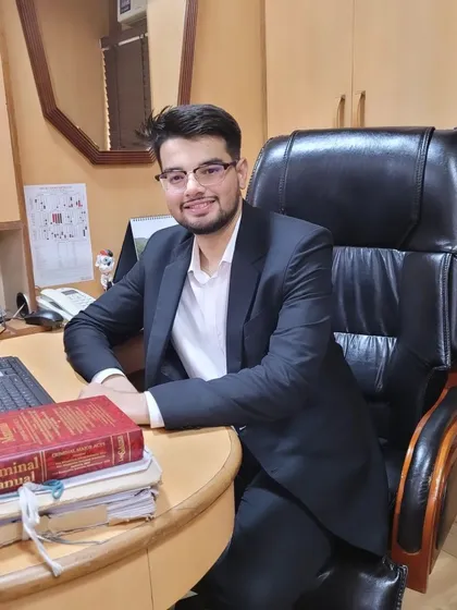 A candid shot from my office. The law is a demanding field that requires constant attention and study, but I am passionate about navigating its complexities to achieve justice for my clients.