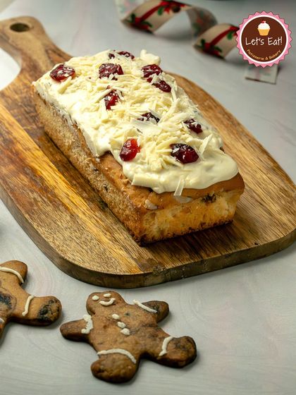 My White Chocolate & Cranberry Loaf is a seasonal special. This moist cake is topped with creamy white chocolate frosting, shaved chocolate, and tart cranberries.