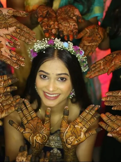 The joy of Mehendi, surrounded by friends and family. For this look, I gave the bride a simple, fresh-faced makeup style and a floral crown to keep it light and fun.