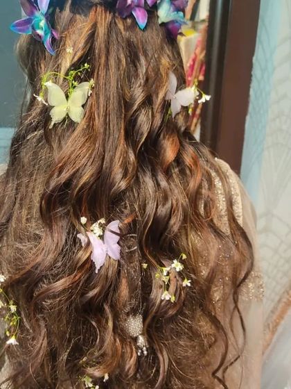 Another view of this beautiful floral and butterfly hairstyle. It's a unique and romantic choice that photographs beautifully.