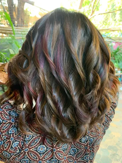 Plum, hazelnut, and chocolate on a short bob. This non-bleach color combination is unique and playful, showing how you can mix tones for a custom look.