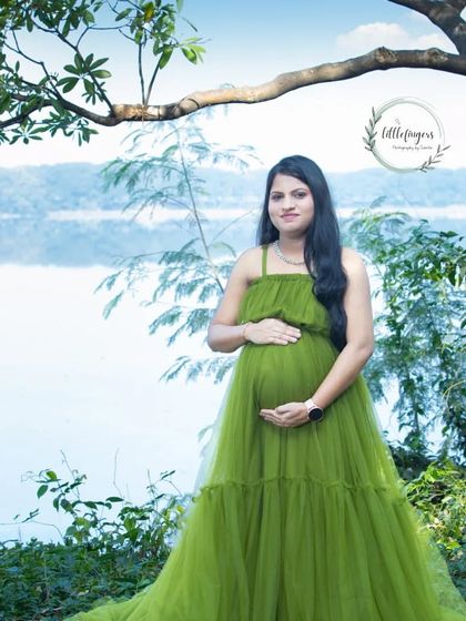 A stunning portrait in a flowing green gown by the water. The layers of tulle and the beautiful natural scenery create a truly ethereal and memorable image.