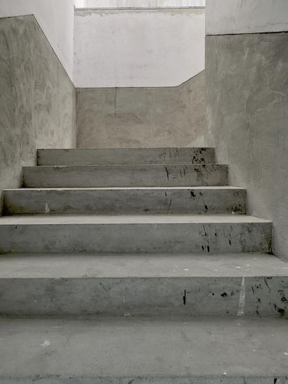 A straight-on view of the raw concrete steps.