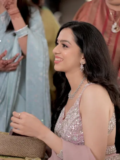 A candid moment from an engagement ceremony. The soft glam makeup, with its focus on luminous skin, looks beautiful and effortless in every light.