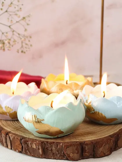 A beautiful arrangement of our pastel Scented Lotus Jars. Each jar is hand-finished with gold leaf, making them a perfect decorative accent or a thoughtful festive gift.