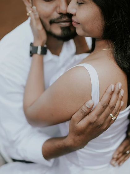 An intimate close-up of a couple from their creative water-themed photoshoot. This image focuses purely on their closeness and affection.