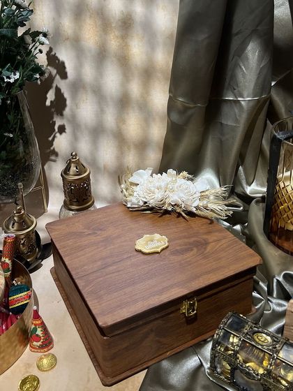 The closed view of the classic wooden box, showing the beautiful wood grain and a custom wax seal.