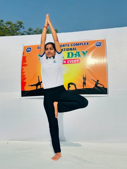 Demonstrating Vrikshasana (Tree Pose) at the Siri Fort countdown event. This balancing pose helps improve focus and stability, a great tool for a busy mind.