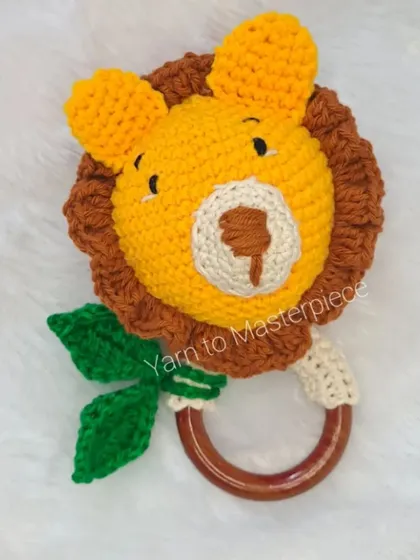 A roaringly cute teether, this lion rattle features a full mane and a friendly face, attached to a safe, smooth wooden ring.