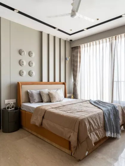 This master bedroom is an artistic expression, designed to evoke a sense of calm and character. The statement wall, adorned with sculptural face art, adds a unique narrative, symbolizing emotion, depth, and the beauty of human expression.