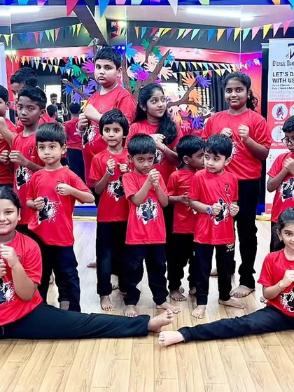 The future champions from our Kids Summer Camp. This group photo captures the energy and discipline of our young Taekwondo students as they strike a pose after a fantastic showcase performance.