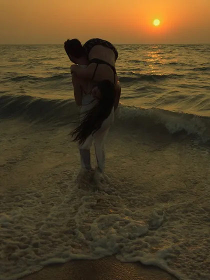 A golden hour pre-wedding photo from a shoot in Kochi. I use the sunset to create dramatic silhouettes and warm, cinematic colors, turning a playful moment in the waves into a piece of art.