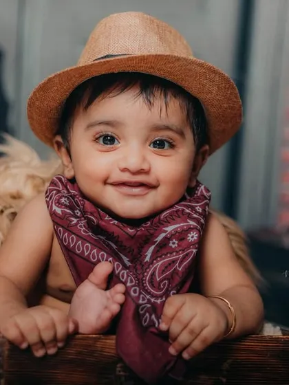 A cheeky smile from the cutest cowboy in town. His personality really shines in this fun, themed session.