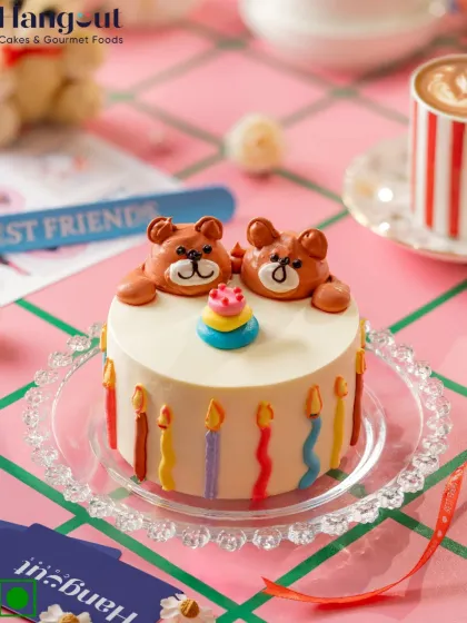 Bears on top, berries inside. This raspberry-flavored bento cake is decorated with tiny bears and party candles, making it a super cute celebration of friendship.