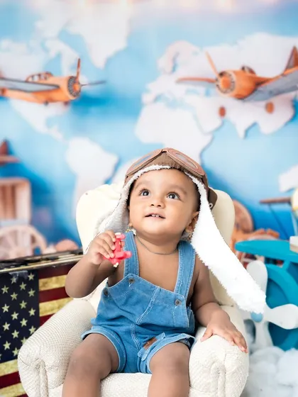Looking up at the skies, dreaming of his next flight. I love capturing these imaginative moments.