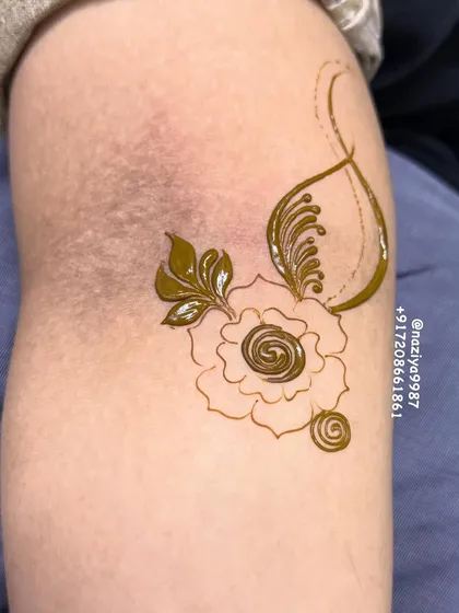 This is how the design starts, with a simple outline of a rose and a few leaves. It's the foundation for a more intricate pattern.