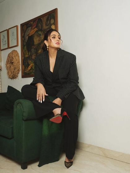 A variation of the seated pose, this image has a thoughtful, off-camera gaze, adding a different mood to the series.