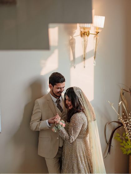 A sweet, intimate moment between Uzma and Amir during their engagement celebration, captured in beautiful, soft light.