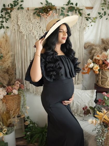 A serene and artistic portrait with eyes closed. This pose, combined with the stylish hat, creates a feeling of peaceful contemplation.