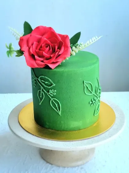 Another angle of the green buttercream cake, showing the piped leaf details.