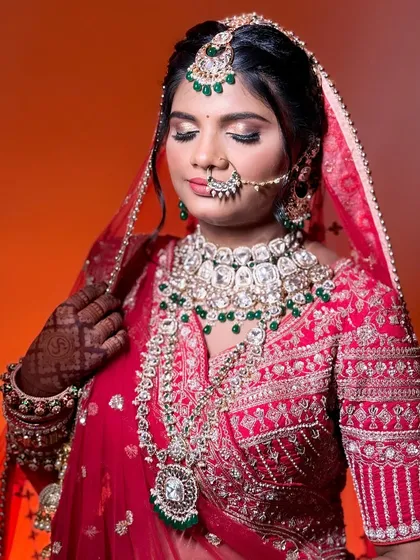 A close-up of the bride with her eyes closed, showing the beautiful shimmer on her eyelids and the perfectly blended eyeshadow.