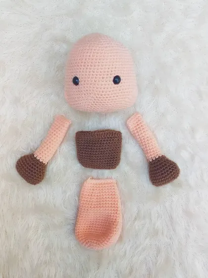 These are the separate parts of the platypus toy before I stitched them all together. You can see the head, body, arms, and feet, all created individually.