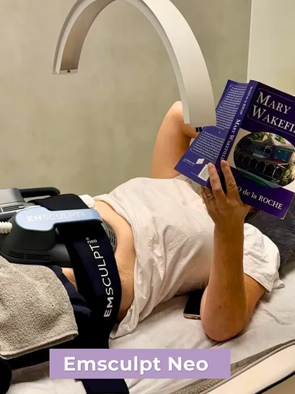 The Emsculpt Neo treatment is so comfortable and effortless that you can relax, read a book, or simply rest while the machine does the work of 20,000 crunches for you. This image captures the ease of a typical session.
