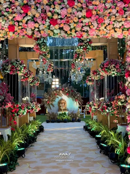 The view from inside the entrance arch, looking towards a beautifully decorated Ganesha statue, welcoming guests with blessings.