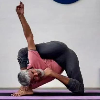 My personal practice is the foundation of my teaching. This is Krishnasana, an advanced posture that requires deep hip opening and spinal flexibility. Dedication to my own journey allows me to guide you on yours with authenticity and experience.