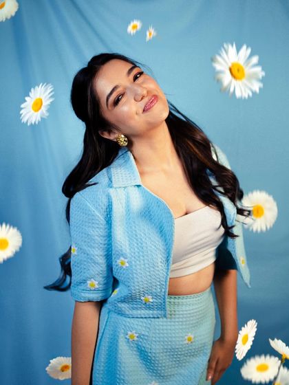 A sweet and fresh look for Ahsaas Channa for the 'Half CA' promotions. The daisy-embroidered blue co-ord set is youthful, charming, and perfect for a themed shoot.