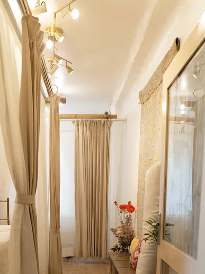 Beauty begins with a perfect atmosphere. The hallway leading to my treatment rooms is designed with soft curtains and warm lighting to create a sense of peace and privacy.