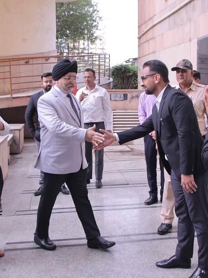 Shaking hands with a senior judge at the inauguration of the newly renovated crèche at Rohini Court, a facility for the children of our fraternity.