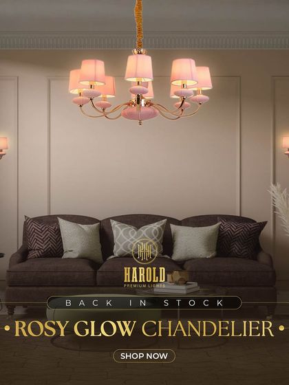 The Rosy Glow Chandelier is back in stock. This popular piece, shown here in a cozy living room, adds a soft, luxurious ambiance with its classic design and gentle pink hue.