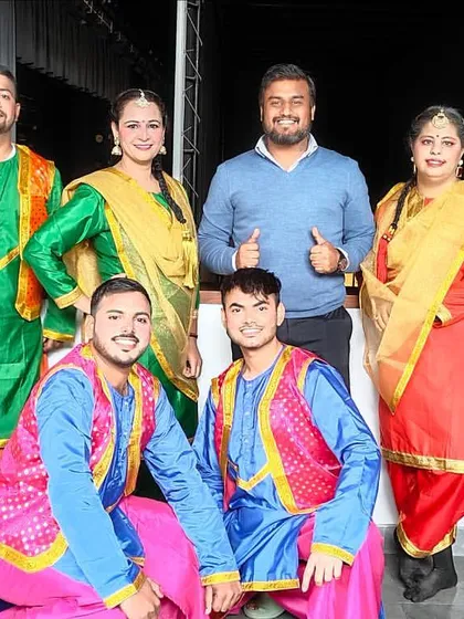 A group photo with the talented Bhangra performers from a corporate awards show. I coordinate with multiple dance troupes to create a diverse and engaging entertainment lineup.