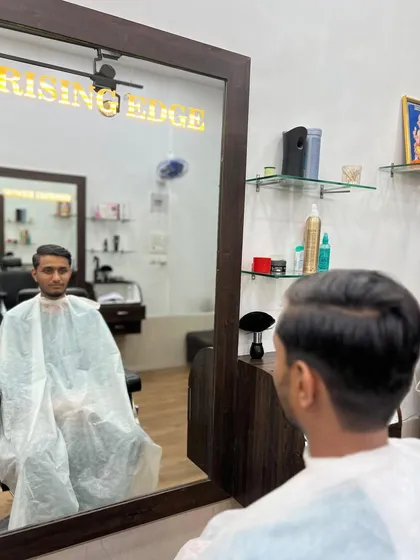 A classic side-part haircut, styled for a clean and professional appearance. This timeless look is perfect for any occasion.