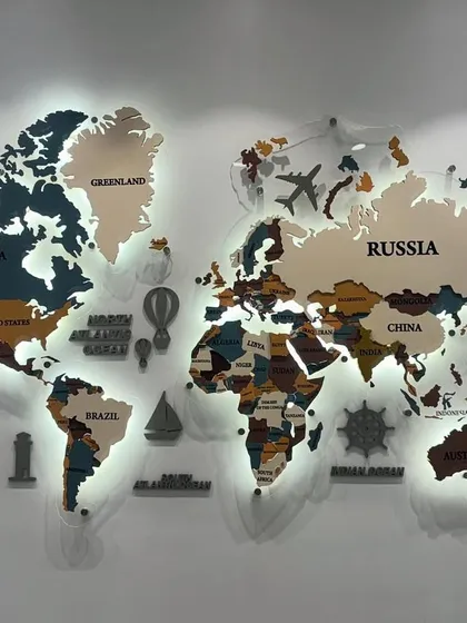For this boardroom, I created a custom backlit world map using a mix of MDF and acrylic. It adds a touch of global sophistication and serves as an inspiring focal point for a forward-thinking company.