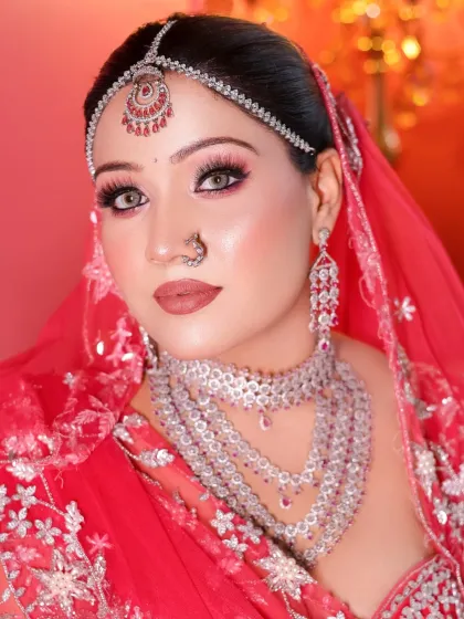 The full look, with a red dupatta adding a pop of color. My students learn how to think about the entire presentation, not just the face.