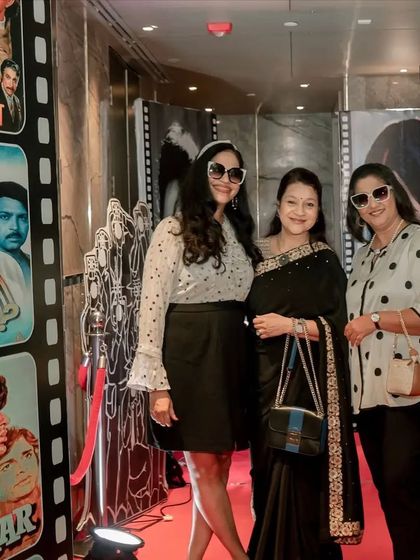 More guests enjoying the themed entrance and posing for photos.