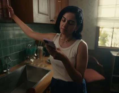 The main character in a simple, casual outfit, reflecting a typical day at home. This realistic styling helps the audience connect with her story.