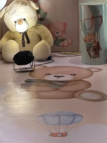 The custom printed flooring for the teddy bear party featured illustrations of teddy bears and hot air balloons, creating a fully immersive experience from the ground up.