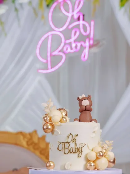 A beautiful shot of my cake at a client's baby shower. The 'Oh Baby' theme with neutral tones and a cute teddy bear topper fit the elegant decor perfectly.
