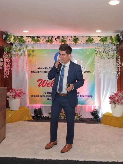 Hosting from the stage at a corporate annual day. The setup was beautiful, and my job was to make sure the energy in the room matched the decor.