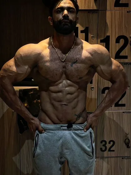 An artistic shot of one of my men's physique athletes. We focus on creating a complete package: size, symmetry, and aesthetics.