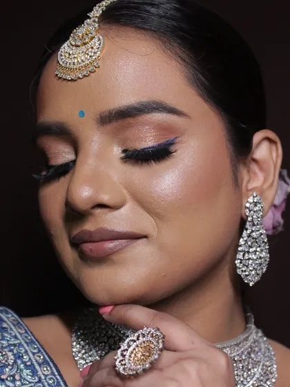 A close-up of the eye makeup, showing the subtle blending and sharp liner.
