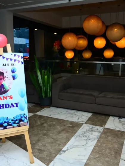 A personalized welcome sign for a birthday party, displayed on an easel at the venue entrance to greet all the guests as they arrive.