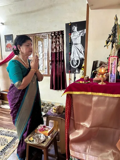 My mother at her daily prayers. Her devotion to the art is deeply intertwined with her spiritual practice, a value she has instilled in me and in our school, Kathak Nritya Mandir.