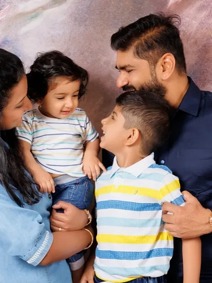 Capturing the interaction between siblings and parents. This shot shows a lovely family moment, with the parents looking at their children with so much love.