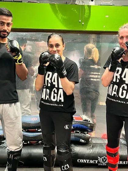 A few of our dedicated students posing after a tough session. The matching shirts show the unity and pride we have in our training.